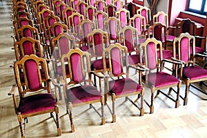 Hall of performances with empty red chairs