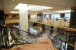 Hall, stairs and a large chandelier in hotel Lotte