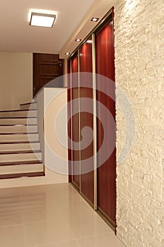 Hall with stairs in modern apartment