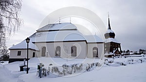 Hallans kyrka and Belltower in winter in Jamtland in Sweden