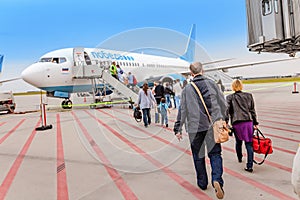 Boarding on POBEDA airlines Russian lowcost Jet airplane in airport