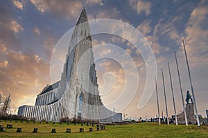 Hallgrimskirkja church and explorer statue in Reykjaivk against sky at sunset