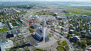 Hallgrimskirkja church Iceland Reykjavik modern architecture. Aerial video footage. down town from the top. Aerial dron