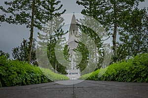 Hallgrimskirkja, a luteran church in the middle of Reykjavik, capital of Iceland, seen from back on a cloudy summer day