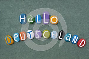 Hallo Deutschland, creative logo composed with hand painted multi colored stone letters