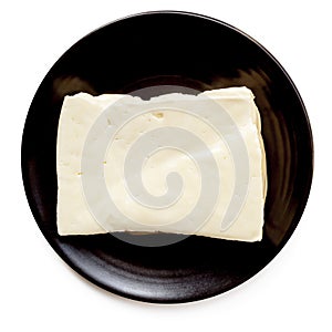 Halloumi Cheese on Black Plate Isolated