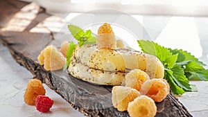 Halloumi cheese with yellow raspberries. Unconventional serving of halloumi cheese. Farm natural product