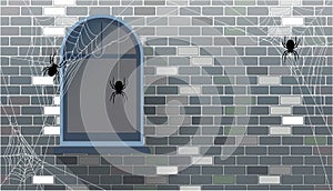 Halloween background with cobwebs and spiders on a brick wall