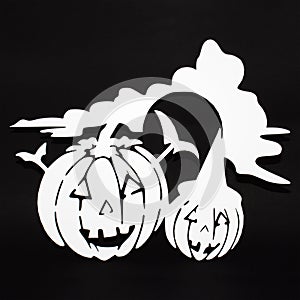 Halloween background decoration holiday concept. Two pumpkins angry faces shadow and silhouette on black background
