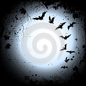 Halloween background with a full moon and bats