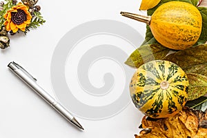 Halloween background with leaves and pumpkins.