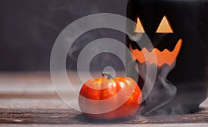 Halloween pumpkin with smoke and light in the dark night