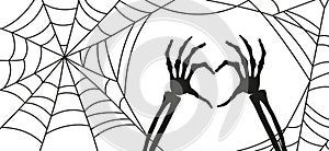 Halloween banner background. Spider web and Skeleton of hand bones showing heart symbol