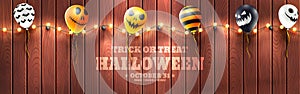 Halloween Banner with Halloween Ghost Balloons.Scary air balloons and string light on wood background.Website spooky or banner
