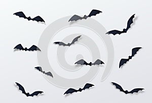 Halloween bat vector decor background. Paper cut style. Black vampire flittermouse flying over white backdrop