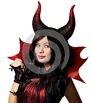 Halloween. Beautiful girl with horns dressed up as devil