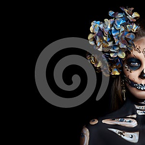 Halloween beauty portrait of a skeleton woman of death, the makeup on the face. Girl death Halloween costume. Day of The Dead.