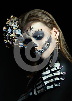 Halloween beauty skeleton woman makeup face. Girl death Halloween costume. Day of The Dead. Charming and dangerous Calavera