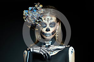 Halloween beauty skeleton woman makeup face. Girl death Halloween costume. Day of The Dead. Charming and dangerous Calavera photo