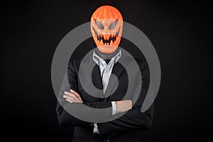 Halloween business man with pumpkin mask