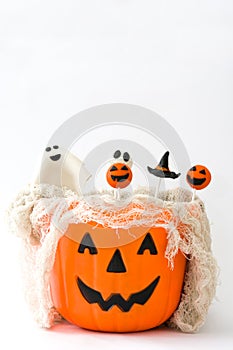 Halloween cake pops in a basket with pumpkin shape