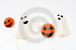 Halloween cake pops with phantom and pumpkin shape isolated on white background