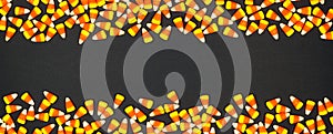 Halloween candy corn double border banner on a black background