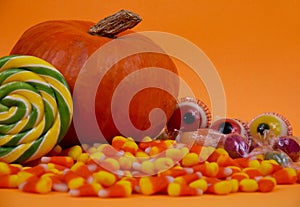 Halloween candy still life on orange background stock images