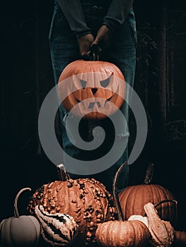 Halloween card with girl holding a Hallooween pumpkin