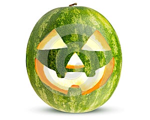 Halloween Carved Watermelon as Pumpkin. Jack O Lantern with burning candle inside. Scary decoration from pumpkins. Happy Halloween