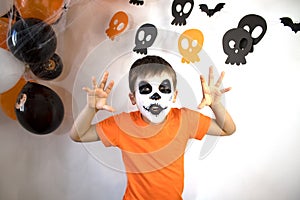 Halloween celebration concept. The boy in spooky make-up.