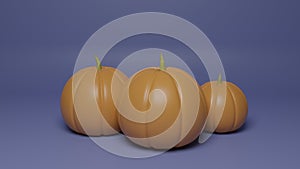 Halloween composition of a three pumpkins on a dark blue background