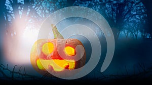 Halloween concept and celebration,with horror at nightmare and spooky forest with dead trees,Jack Oâ€™ Lanterns Glowing or smiling