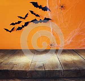 Halloween concept. Empty table in front of spider web