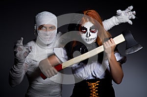 Halloween concept with mummy and woman