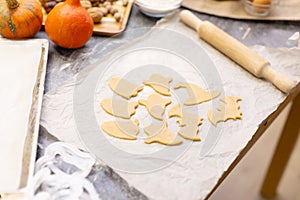 Halloween cookies on a bug, wooden rolling pin. kitchen.