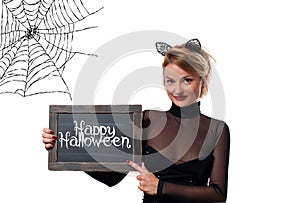 Halloween costume. Woman with carnival cat ears holding chalkboard