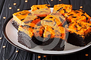 Halloween Cream Cheese Brownies cake delicious dessert for a festive treat closeup on a plate. horizontal