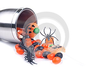 Halloween cup spilling candies