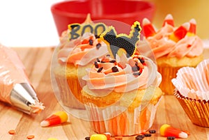 Halloween cupcakes being frosted