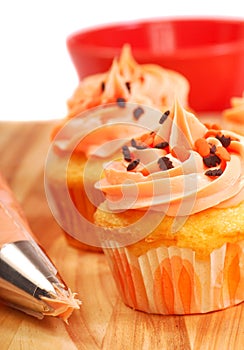 Halloween cupcakes being frosted