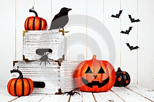 Halloween decor against a white wood background