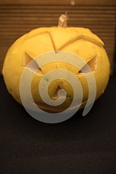 halloween decorated pumpkin isolated on black