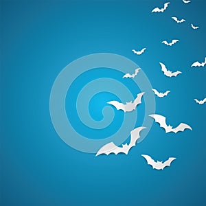 Halloween and decoration concept - white paper bats flying over skyblue background.