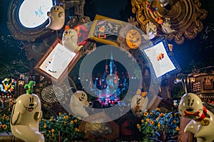 Halloween decorations at Disney with ghost figures and castle in background