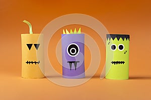 Halloween DIY and kids creativity. Eco-friendly reuse recycle from toilet roll tube. Children Paper Craft monster, pumpkin,