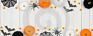 Halloween double border banner with black, orange and white decor and candy over white wood