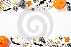 Halloween double border banner with Halloween decorations, pumpkins, skeleton hands, bats, spiders, webs, confetti on white