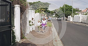 Halloween, excitement and children in costume with grandparents on a neighborhood street to trick or treat. Holiday