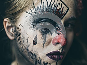 Halloween, the face of a girl is a doll, the floor of a face is dead. A woman with a horrible make-up.